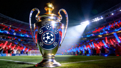 欧冠联赛奖杯在聚光灯下闪耀，背景是球场和观众席